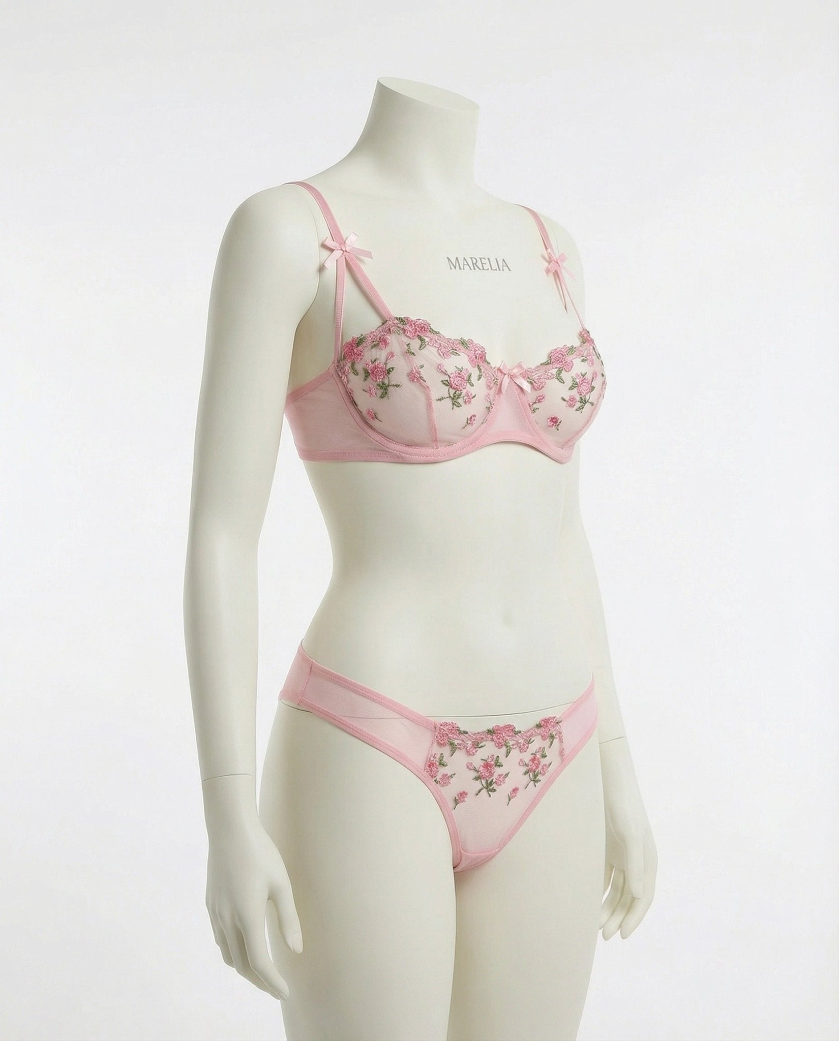Pink embroidered mesh bra and brief front view on mannequin